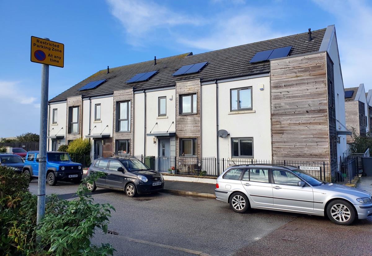 A row of mid-terrace houses in a residential street